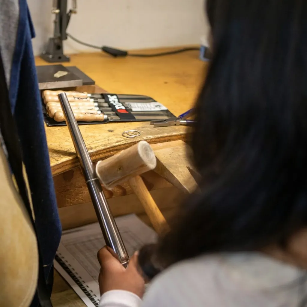 Open air silversmith studio bench with hand tools in Sanur, Bali