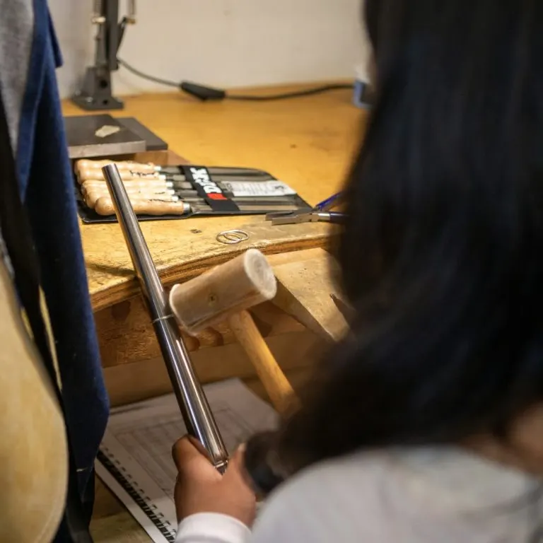 Open air silversmith studio bench with hand tools in Sanur, Bali