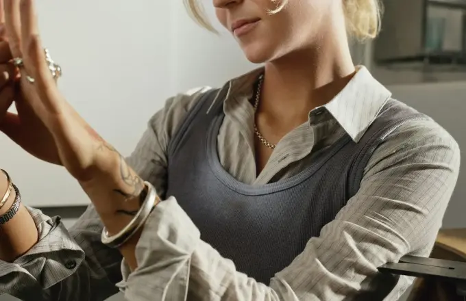 Traveller inspecting her finished handmade silver ring after a Bali silver class