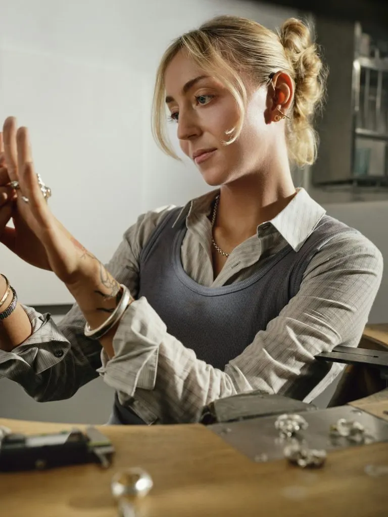 Traveller inspecting her finished handmade silver ring after a Bali silver class